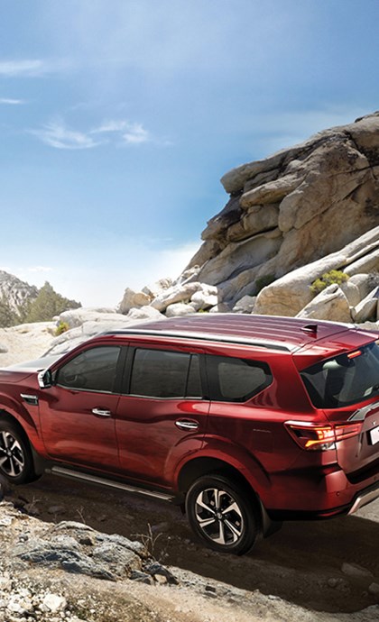 Red Nissan Terra driving off-road